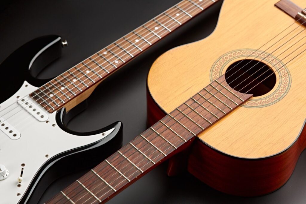 modern-electric-and-retro-acoustic-guitars-closeup-e1649228175195.jpg